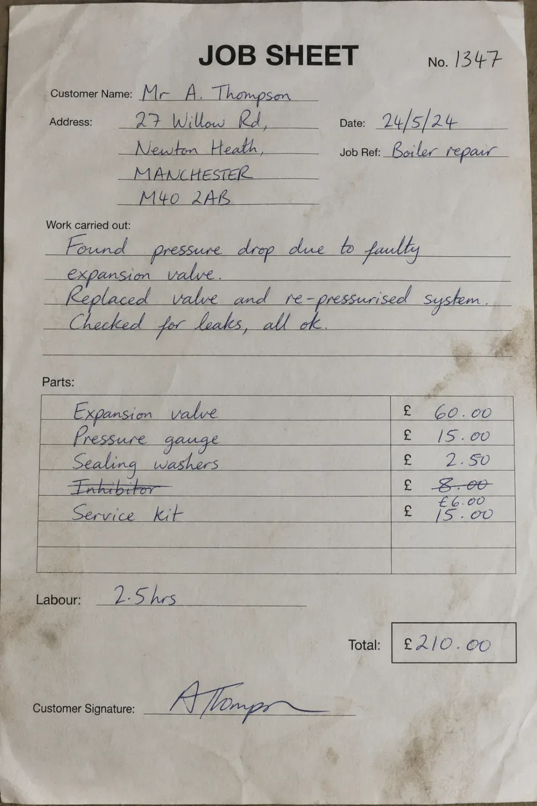 A handwritten field-service job sheet