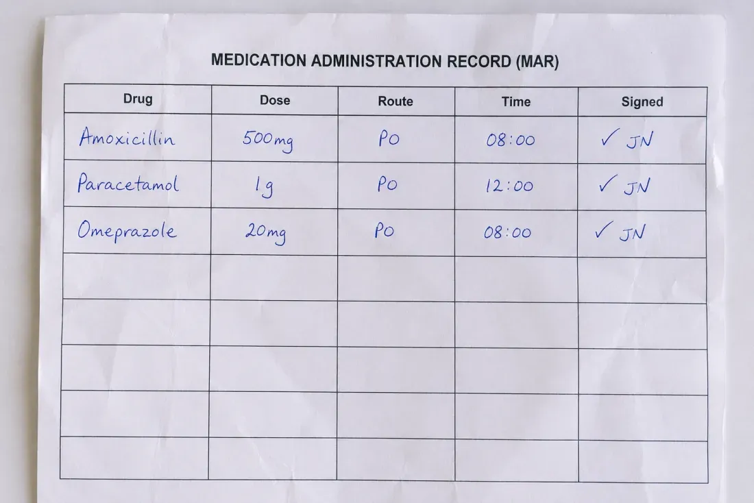 A handwritten medication administration record chart